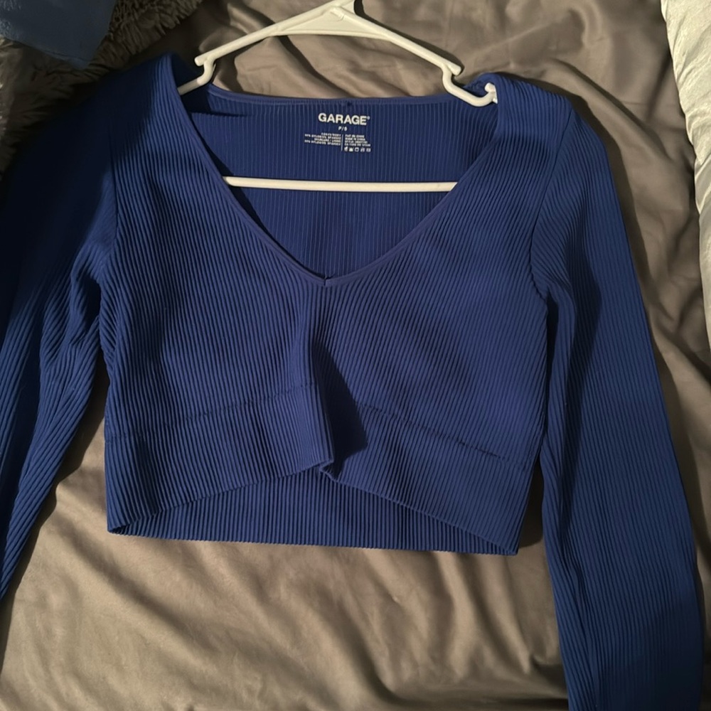 a long sleeved blue tight shirt